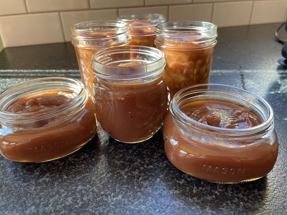 open jars of apple butter