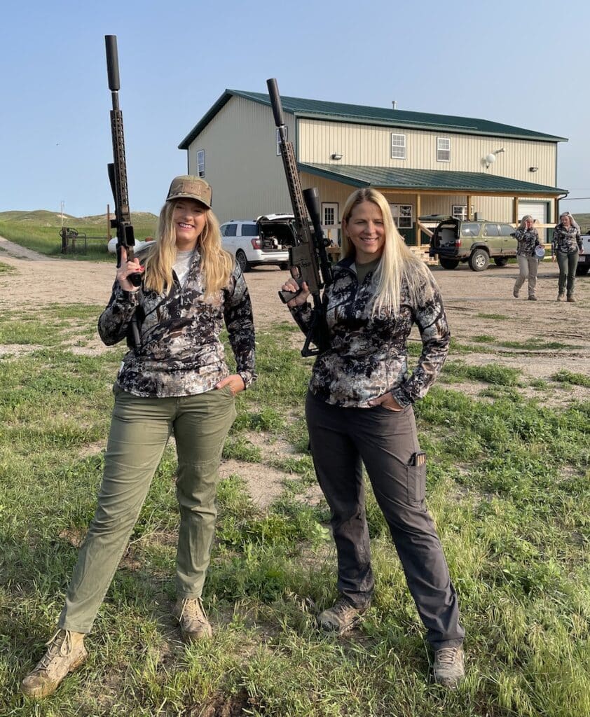 Two women wearing Cronos 1:4 zip tops