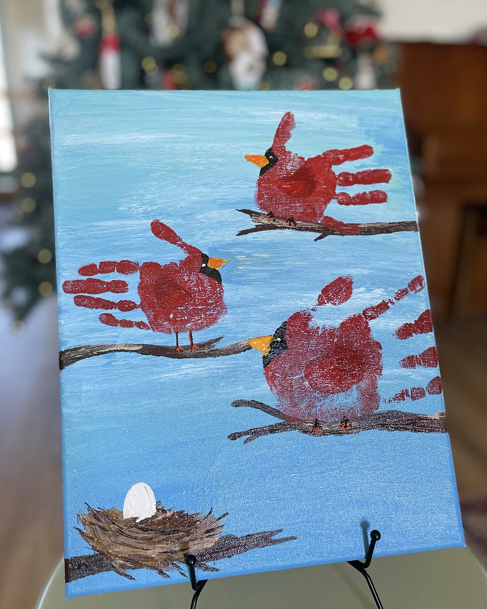 Christmas Cardinals in front of tree