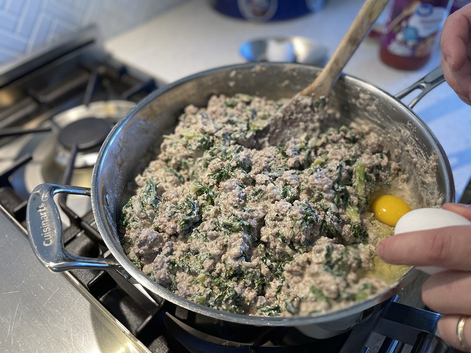 Adding egg to manicotti filling