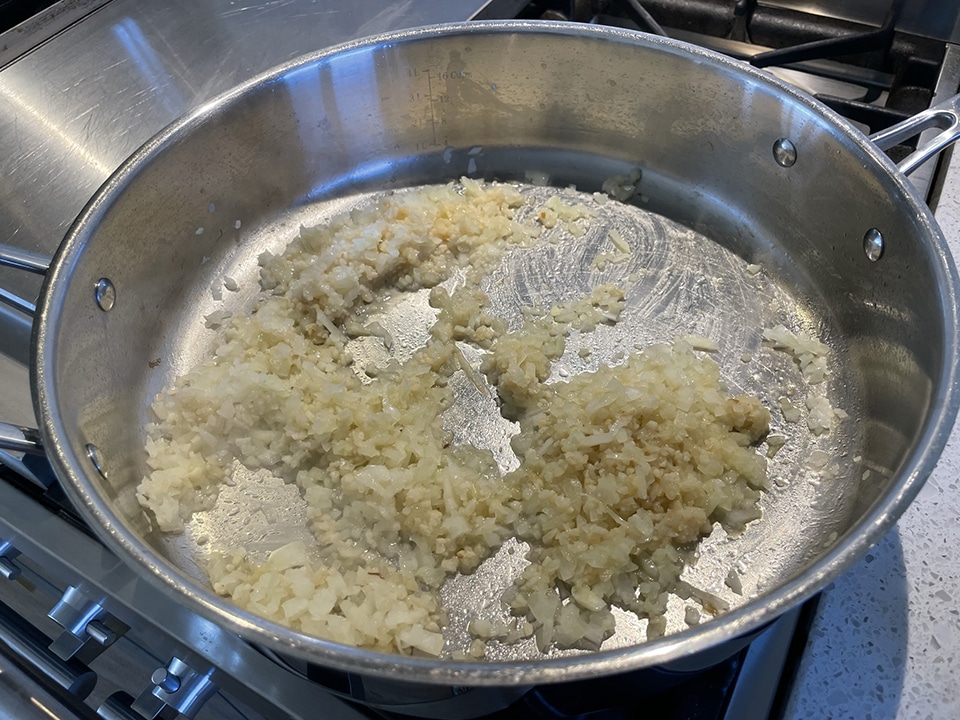 Cooking onions and garlic for manicotti