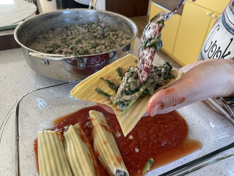 Filling the manicotti noodles