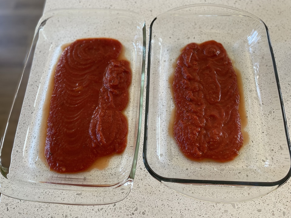 Sauce for manicotti at bottom of pan