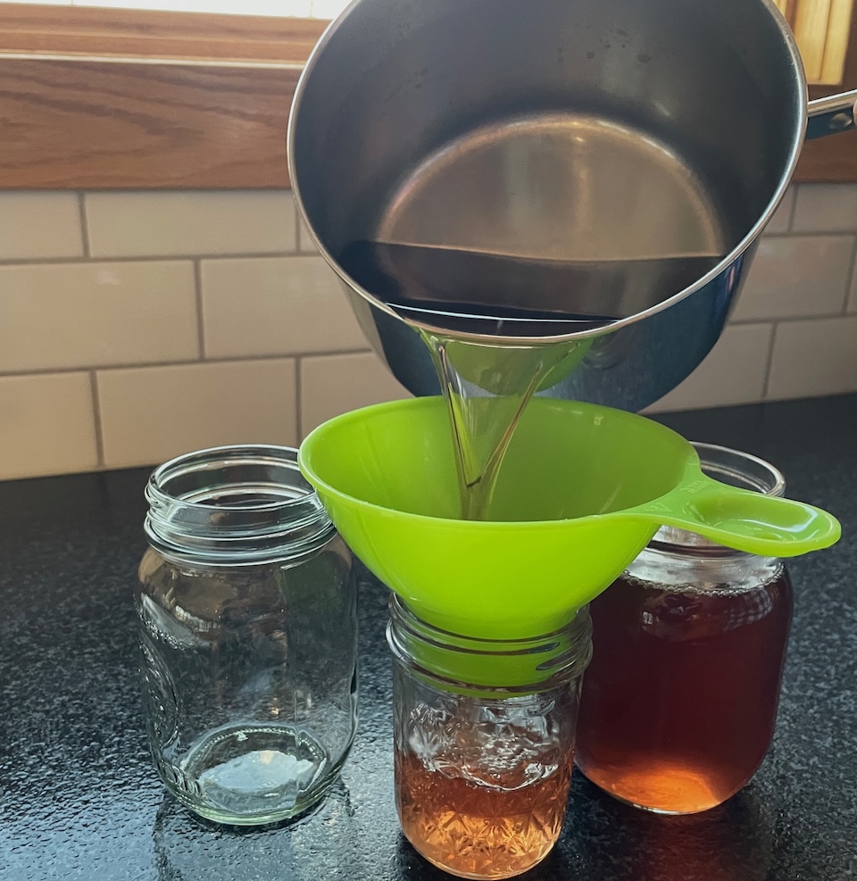 Pouring redbud syrup