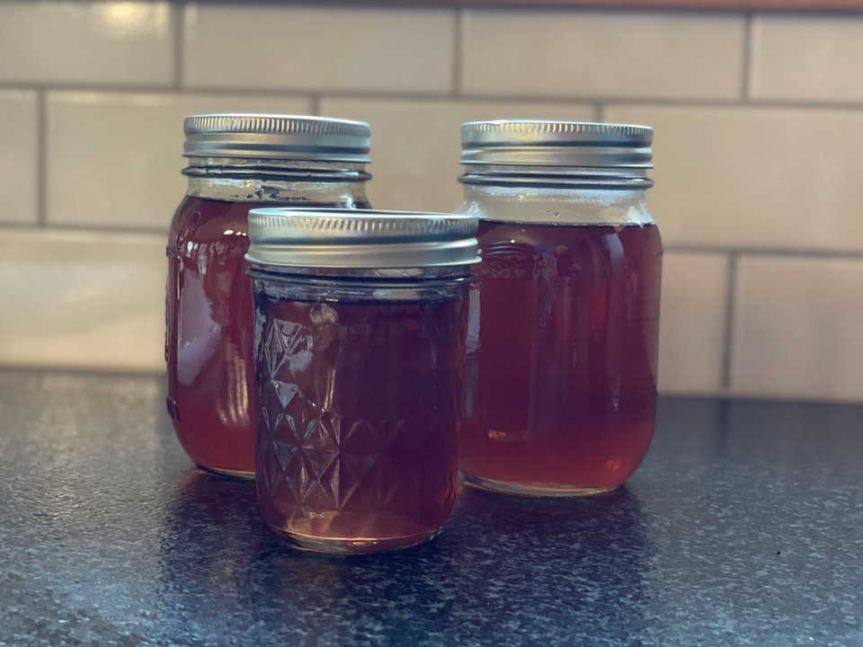 Redbud simple syrup in jars