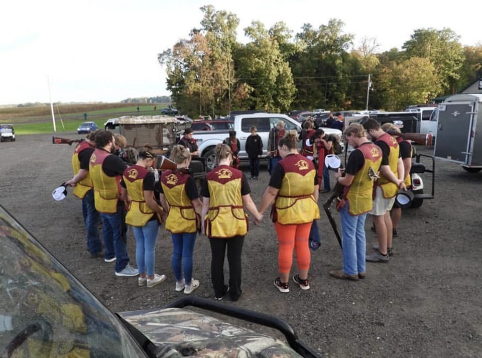 Shotgun group praying