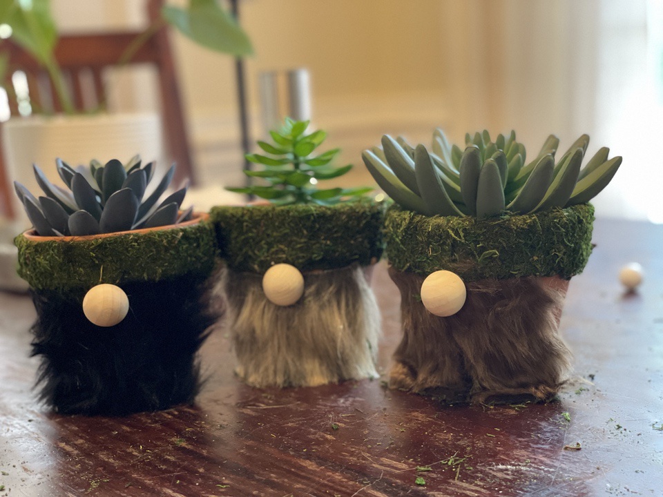 three clay gnome pots