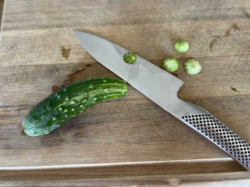 Slicing off the blossom ends