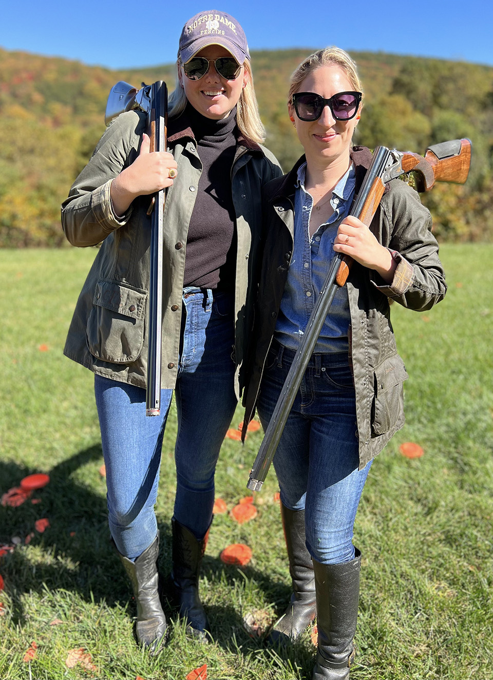 Syren shotguns posed in field