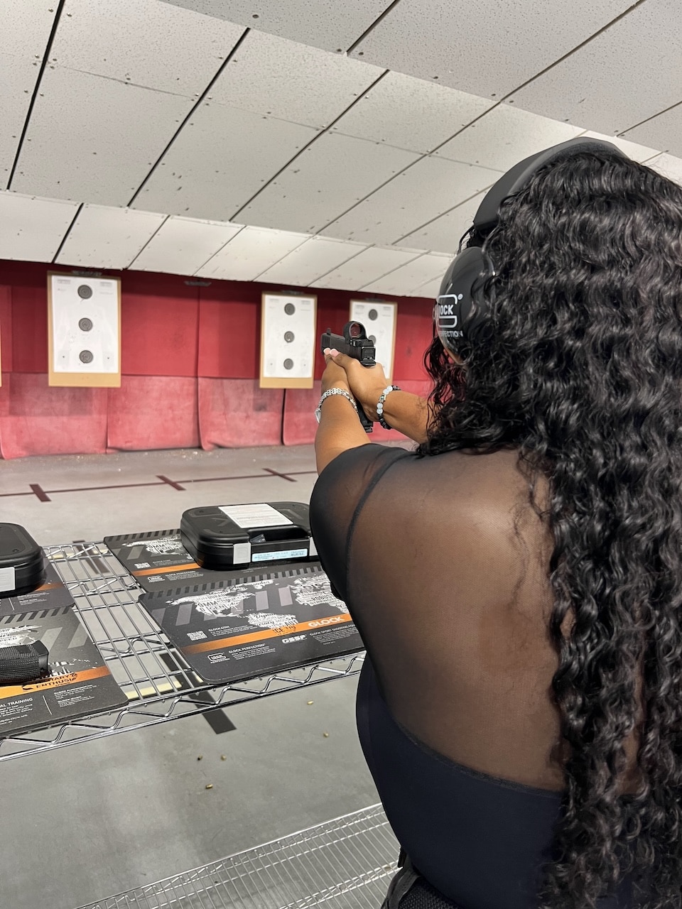 Avery shooting a GLOCK Gen 6 pistol