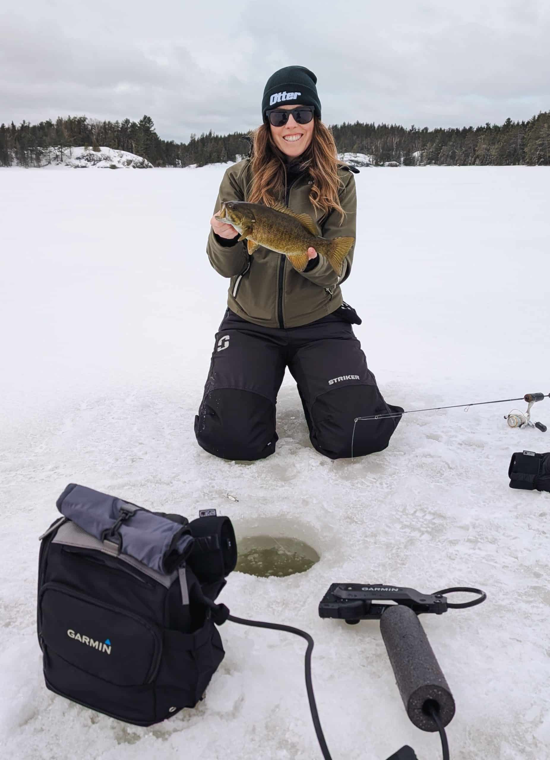 Ashley with a smallmouth bass.  ice fishing adventure
