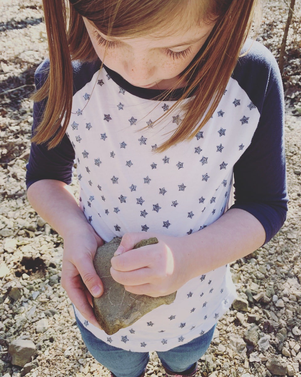 girl with rock