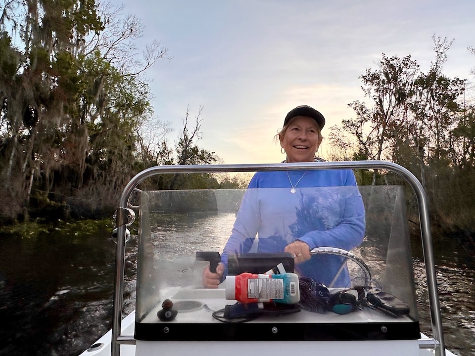 Liz Whitaker driving boat
