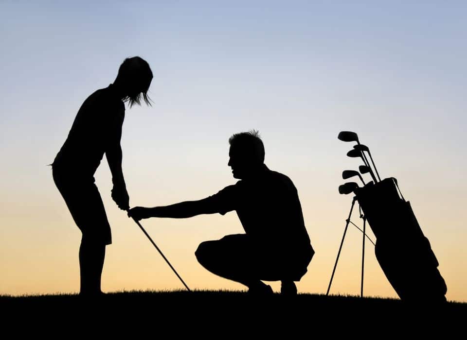 woman learning to golf