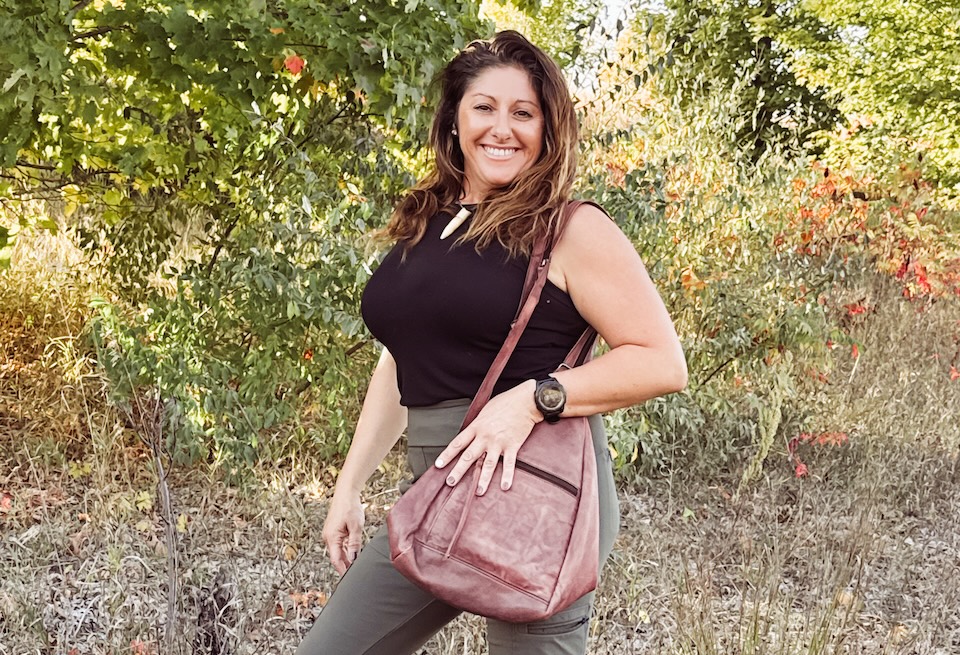 A woman in leggins with a cc handbag Concealed Carry