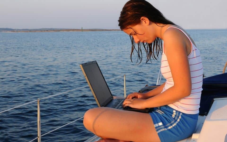 woman on boat computer