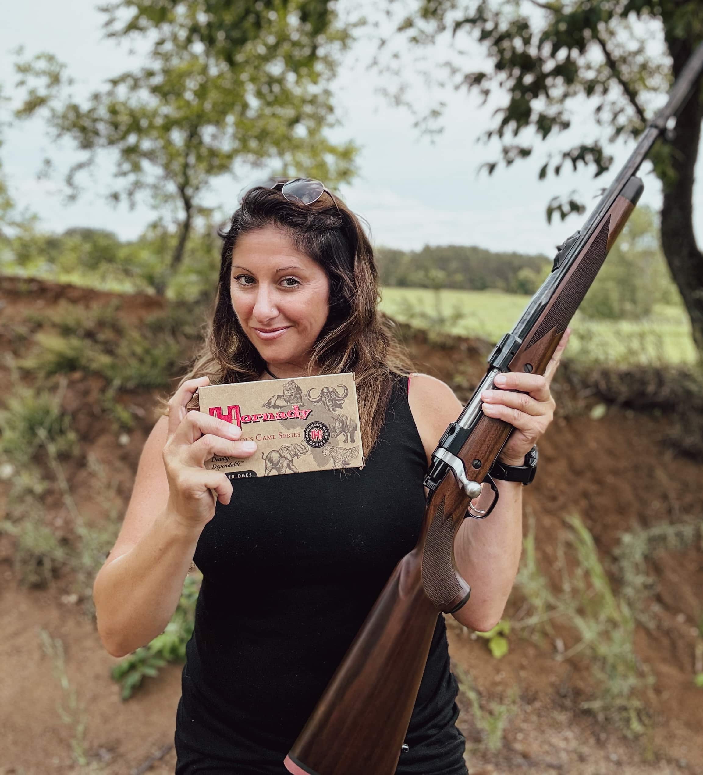 Woman holding 375 Ruger and Hornady ammo