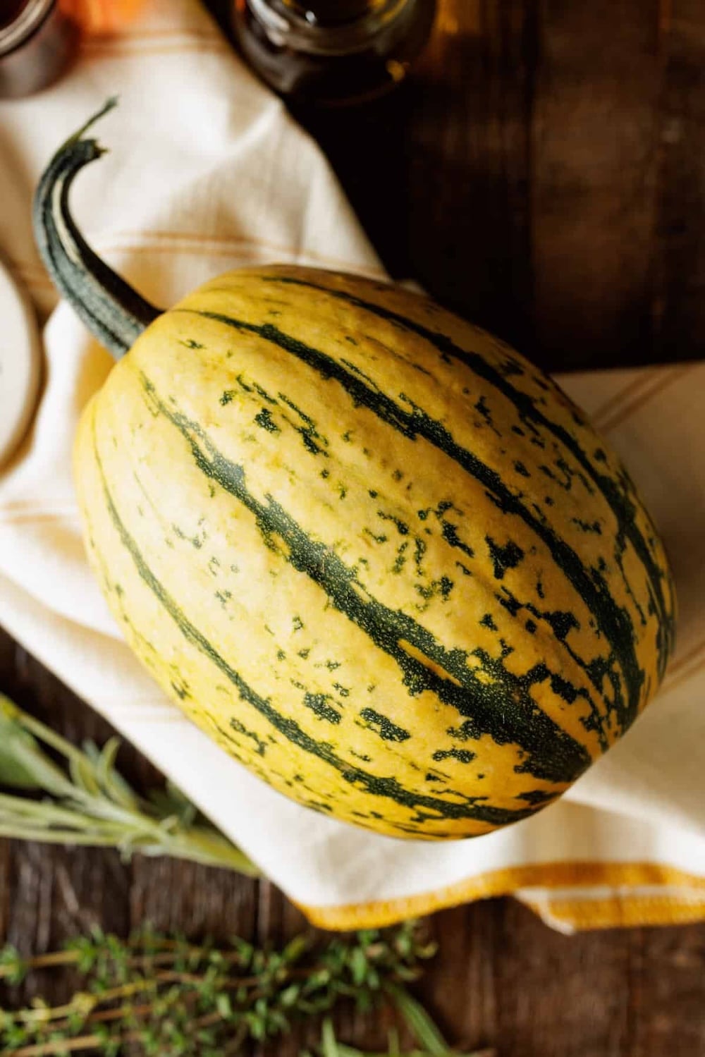 delicata-squash-on-white-linen
