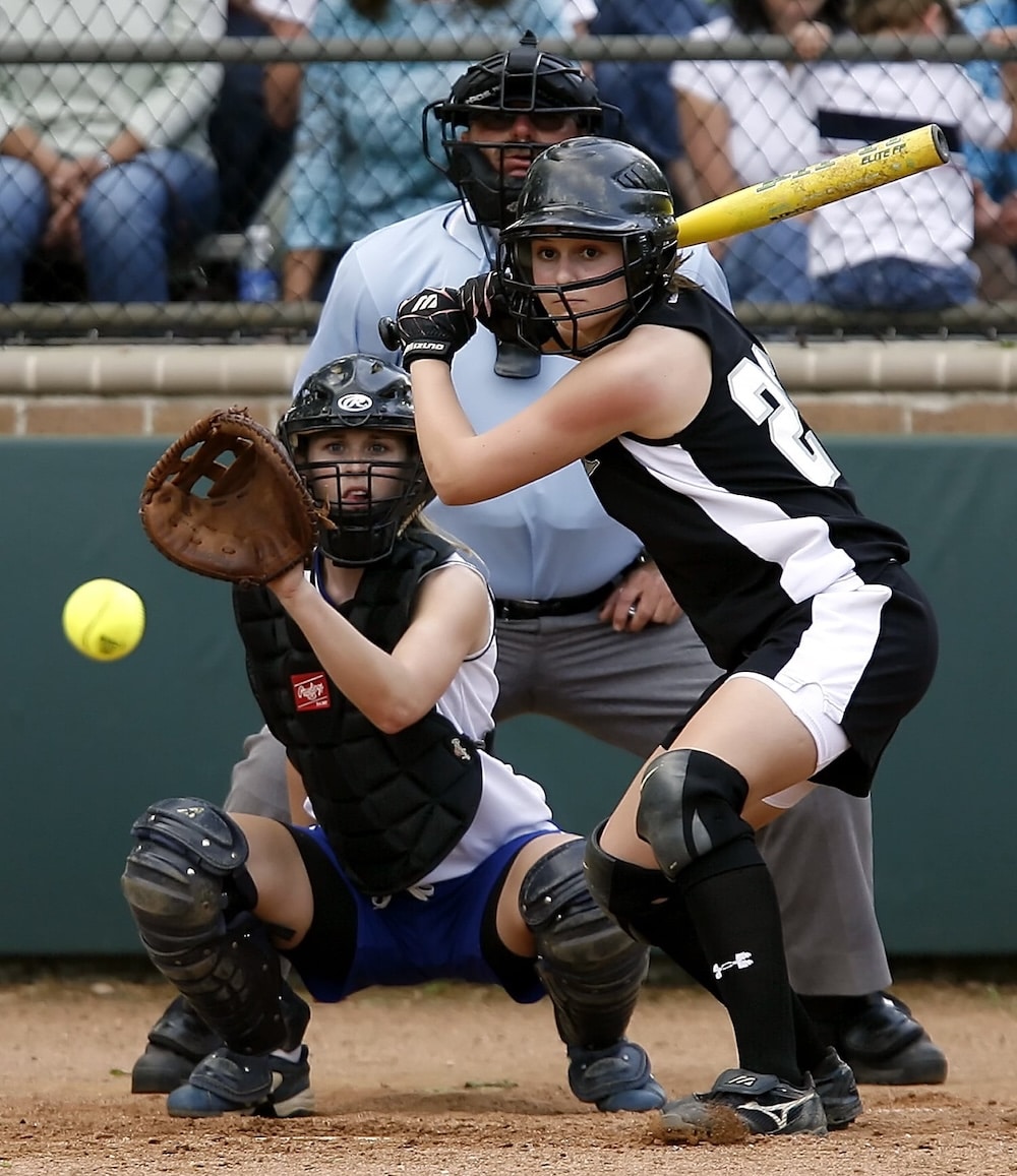 woman playing baseball
