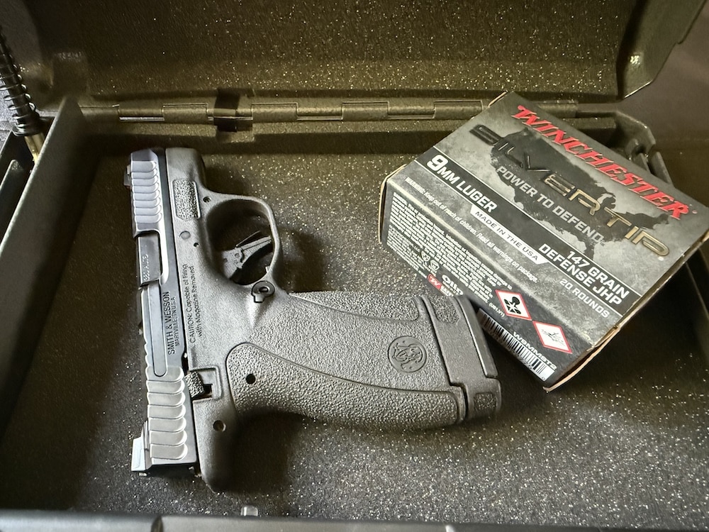 Photo of pistol and ammo in lockbox